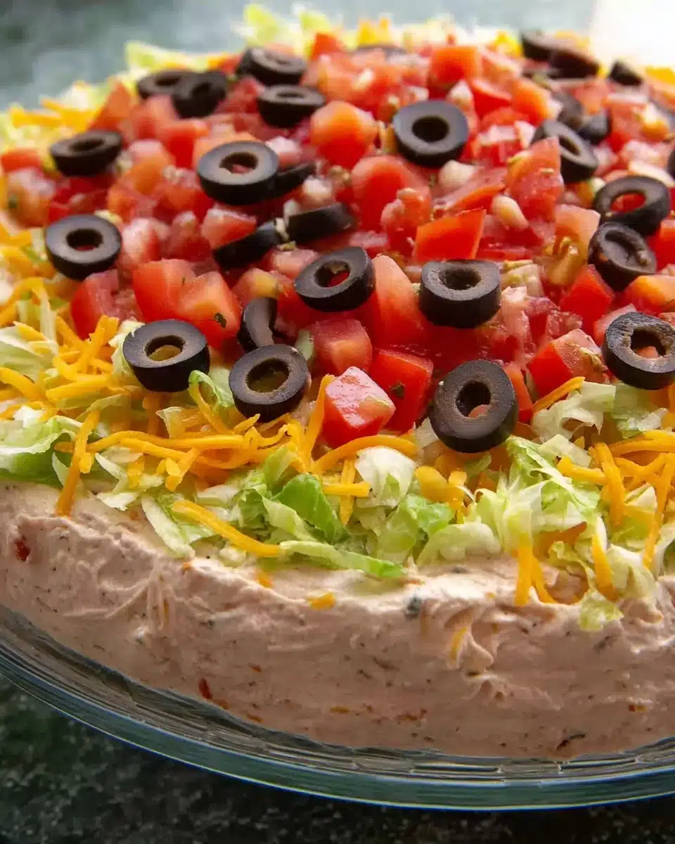 This taco dip comes together in minutes and is sure to be a hit at your next get together Recipe