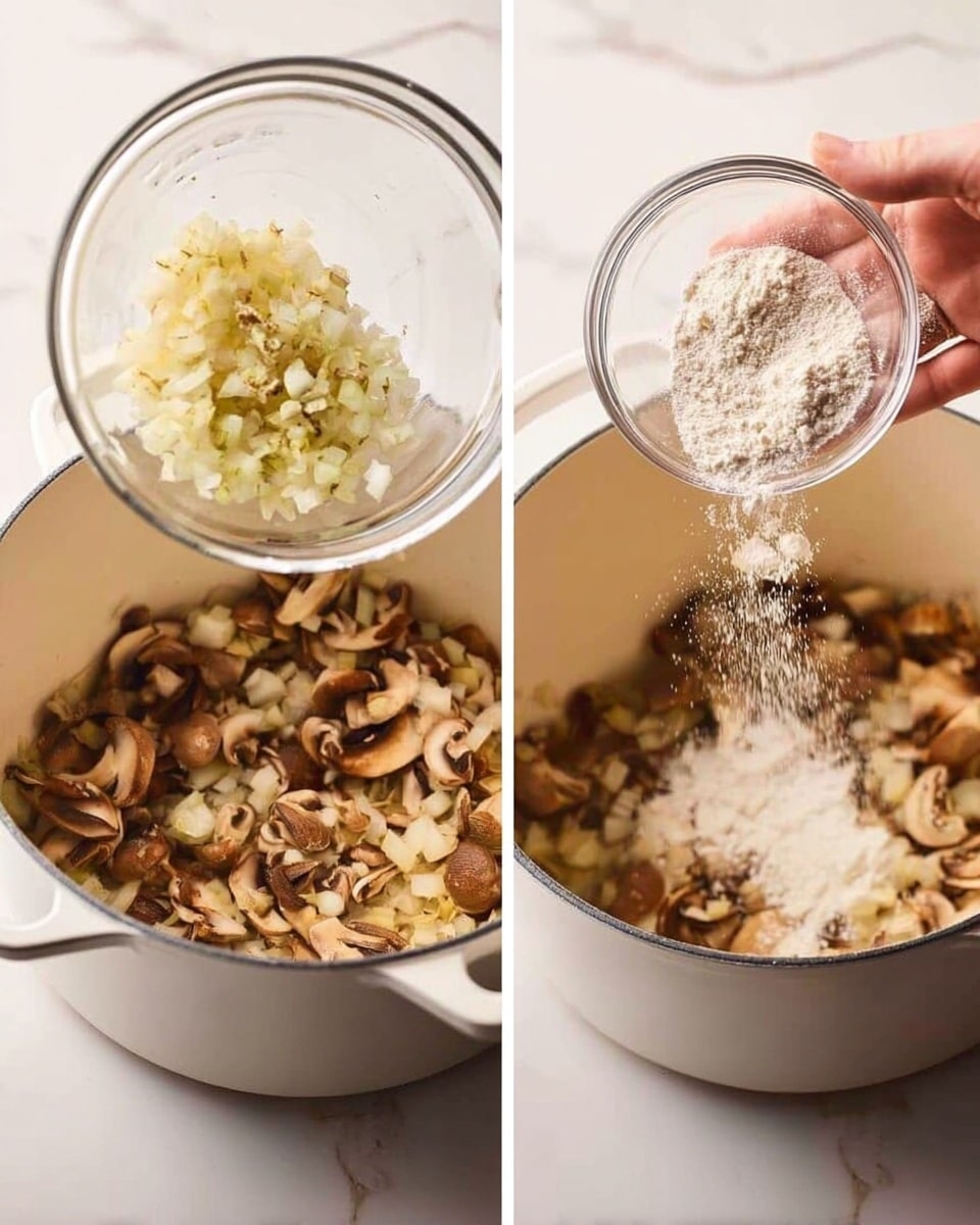 A white round bowl with blue floral and fruit patterns around the edge holds a creamy light beige soup with several medium-sized brown mushroom slices and tiny green herb leaves floating inside. The bowl sits on a white marbled surface with a sprig of fresh green herbs beside it. To the right, a large white pot containing more soup is partially visible with a wooden spoon inside. A soft pink cloth and a gold spoon lay to the left of the bowl. Photo taken with an iphone --ar 4:5 --v 7