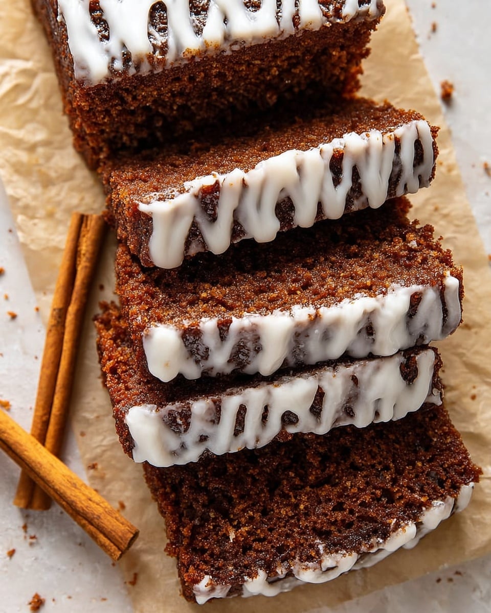 The image shows a close-up view of four slices of brown spiced cake with a moist texture. Each slice has visible crumbs and a rough surface. White icing is drizzled unevenly over the top and sides of each slice, creating thin, messy lines that contrast with the darker cake. The cake slices are laid on a piece of tan parchment paper, and a white marbled surface is slightly visible in the background. The overall look is rustic and homemade, with warm brown and white tones. photo taken with an iphone --ar 4:5 --v 7