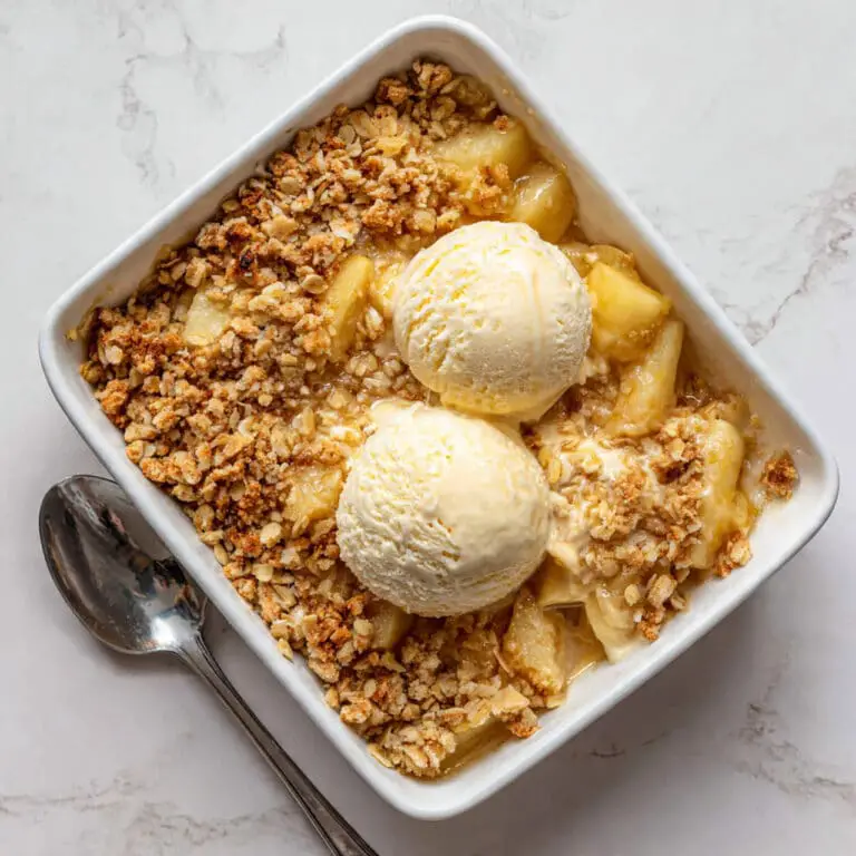 Delicious Apple Crumble with Cinnamon Oat Topping and Vanilla Ice Cream Recipe