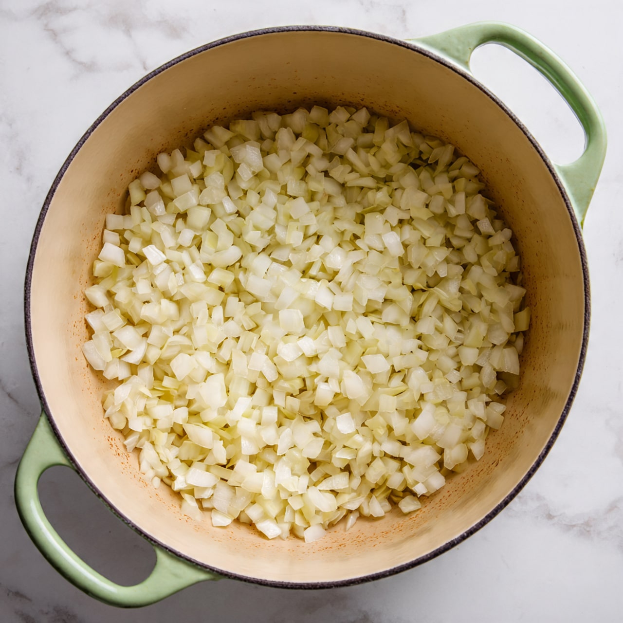 Two white bowls filled with a colorful vegetable stir-fry are shown. The dish has several layers: a base of sautéed cabbage with mixed textures of soft and slightly crunchy pieces, bright orange carrot strips, thin slices of red bell pepper, and some translucent cooked onions. Scattered over the top are green chopped scallions and small white sesame seeds that add texture. A gold spoon is partially dipped into the lower bowl. To the left, there is a small wooden bowl with green lime wedges, and on the right side, a mustard yellow cloth with frayed edges rests on the white marbled surface. Photo taken with an iphone --ar 4:5 --v 7