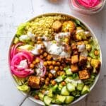Roasted Cauliflower and Sweet Potato Buddha Bowl with Chickpeas and Tzatziki Recipe