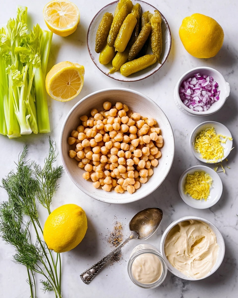 A white bowl filled with light brown chickpeas sits near the center on a white marbled surface, surrounded by a few white small dishes containing mayonnaise-like sauce with a spoon, grated yellow lemon zest, chopped purple onions, olive oil, and a small amount of black pepper and salt. Nearby, there is a white plate with six pickled yellow-green peppers and a bunch of fresh green dill. Two halves of a bright yellow lemon and two fresh celery stalks lie near the top of the scene. The overall look is clean and fresh with a bright light. Photo taken with an iphone --ar 4:5 --v 7