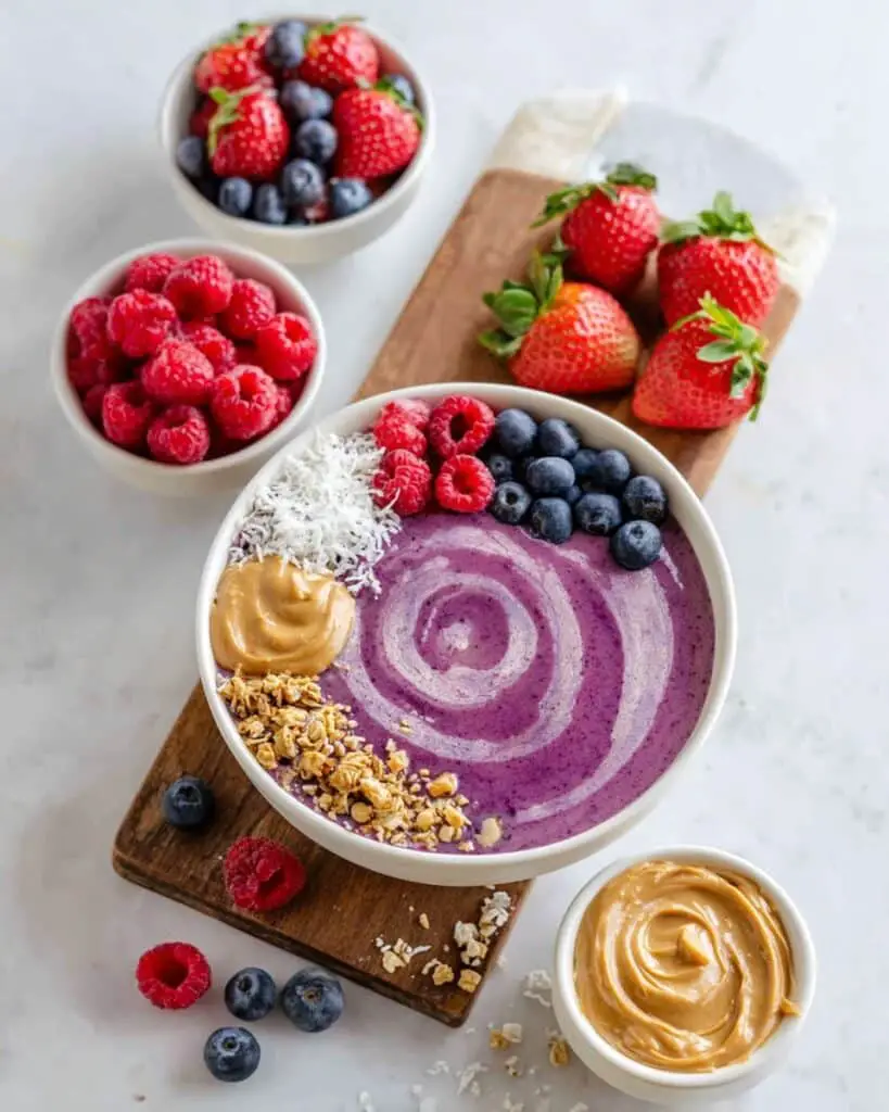 Berry Smoothie Bowl with Granola, Coconut Flakes, and Nut Butter Recipe