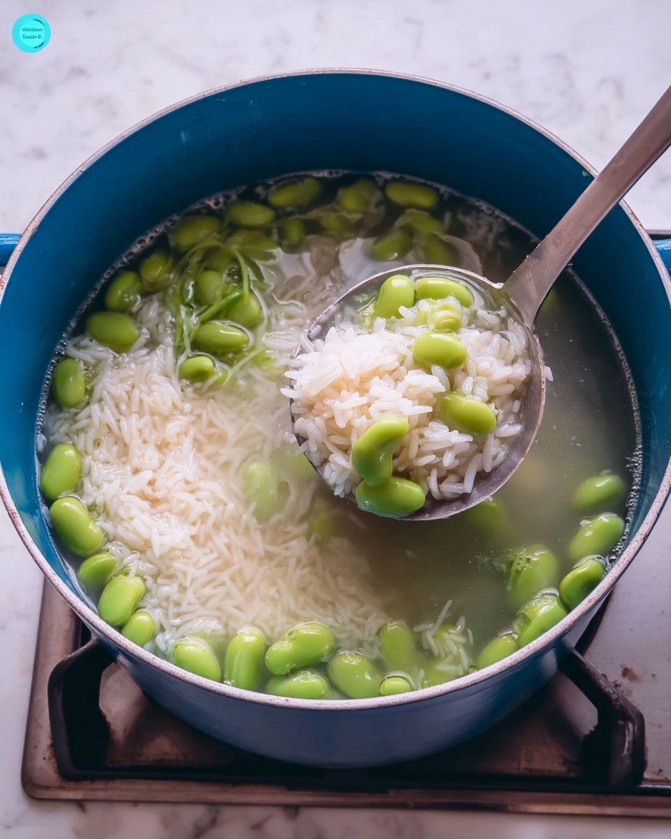 A white bowl filled with three distinct layers: on the left side, a mix of yellow and white cooked rice with green broad beans scattered throughout, seasoned with herbs; in the center, a golden brown, crispy triangular layer resting on top of the rice; and on the right side, a serving of shiny, orange chickpeas in sauce. The bowl sits on a white marbled surface. photo taken with an iphone --ar 4:5 --v 7