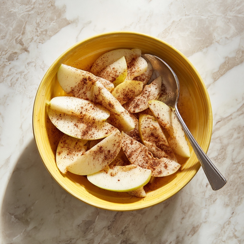 A round rustic pie with a golden brown crust sits on crumpled white baking paper over a white marbled surface. The pie is sliced into eight pieces, with one slice being lifted by a silver spatula. The pie's top layer shows a lattice pattern with thick strips of dough, and a light beige glaze is drizzled generously in a crisscross style all over the pie. To the upper right of the pie, there is a clear glass bowl with more glaze inside and a silver fork resting in it. In the upper left corner, there is a stack of white plates with three silver forks placed on top. Photo taken with an iphone --ar 4:5 --v 7