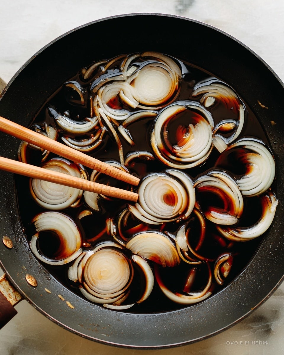 A wooden spoon holds a few layers of food above a white bowl with blue edges. The bottom layer on the spoon is white rice with a soft, slightly sticky texture. Above the rice are tender pieces of brown cooked meat mixed with translucent cooked onions that have a slightly golden edge. On top of the meat are thin, bright red strips of pickled ginger adding a pop of color. The background shows more of the same dish inside the white bowl on a wooden surface. A woman's hand grips the wooden spoon. photo taken with an iphone --ar 4:5 --v 7