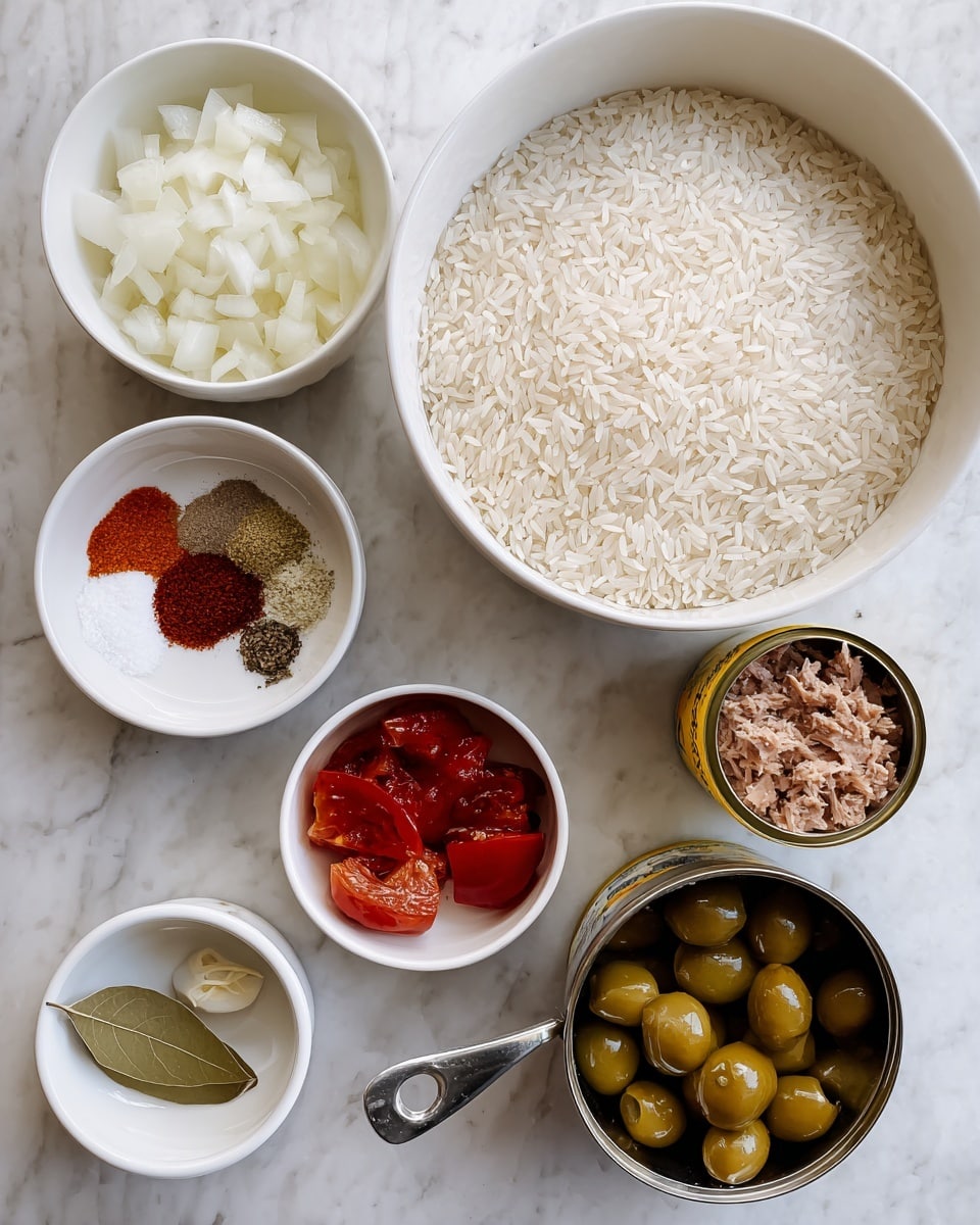 The image shows several bowls and a can arranged on a white marbled surface. In the center, there is a large white bowl filled with uncooked long white rice grains. Above it, a white bowl holds small white chopped onions, and next to it on the right is an open yellow can filled with brown tuna flakes. Below the bowl of onions is a white bowl with dark red tomato wedges that have a wet, shiny texture. To the left, another white bowl contains a mix of three spices: red paprika, white salt, and black pepper. Below this, there is a white bowl with a small amount of minced garlic and a green bay leaf. On the bottom right, a metal measuring cup holds green olives stuffed with red pimento, shining under the light. photo taken with an iphone --ar 4:5 --v 7