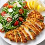 Crispy Chicken Milanese with Arugula, Tomatoes, and Parmesan Recipe