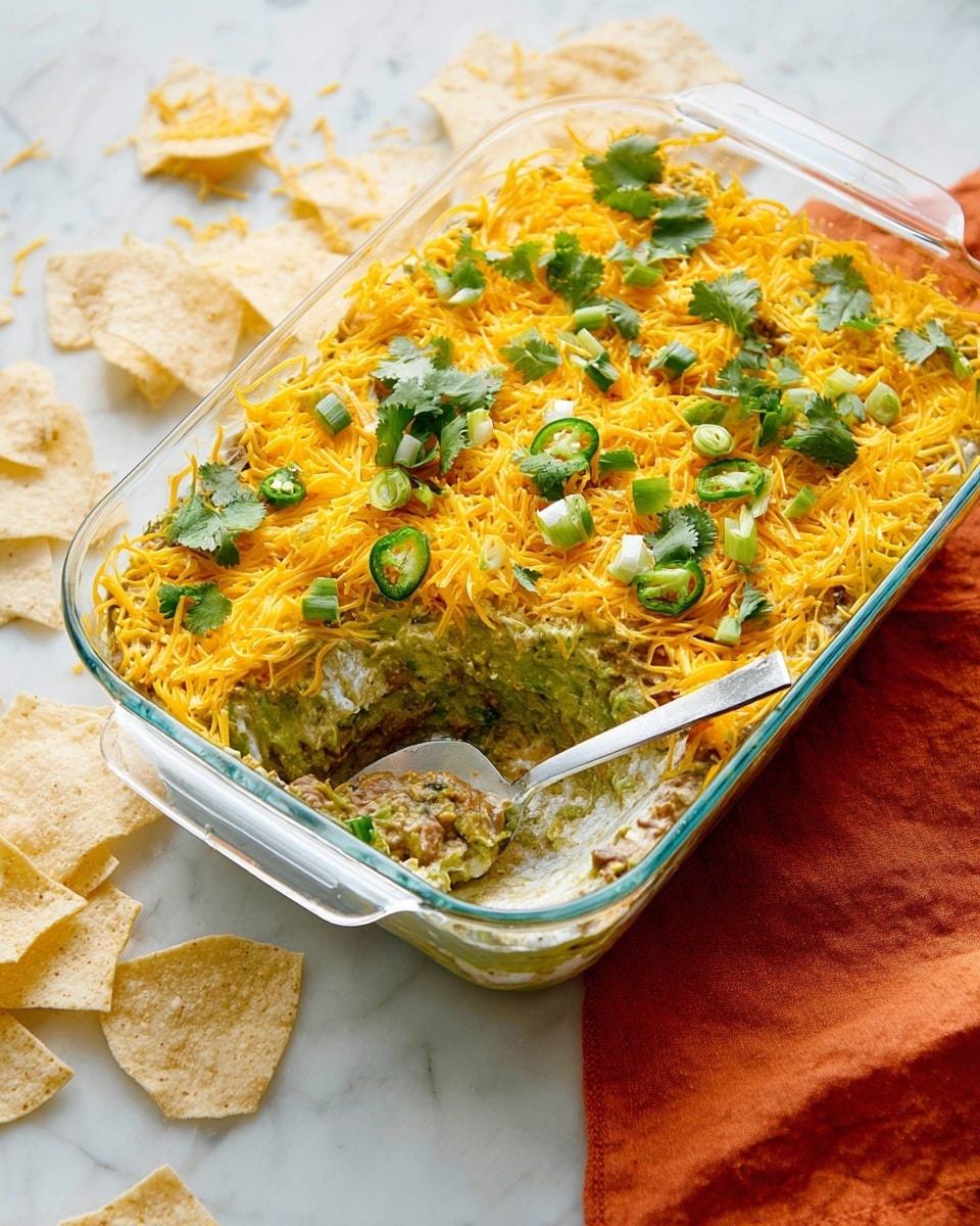 A clear glass dish with six visible layers shows a dip. The bottom layer is brown refried beans with a smooth texture. Above it is a bright green layer of guacamole that looks creamy. Next is a white creamy layer, topped by a layer of shredded yellow cheddar cheese. Over the cheese, there are chopped green peppers and fresh cilantro leaves spread evenly. A woman's hand holds a pale yellow tortilla chip, dipping into the cheese layer. The dish sits on a white marbled surface with a few tortilla chips nearby. photo taken with an iphone --ar 4:5 --v 7