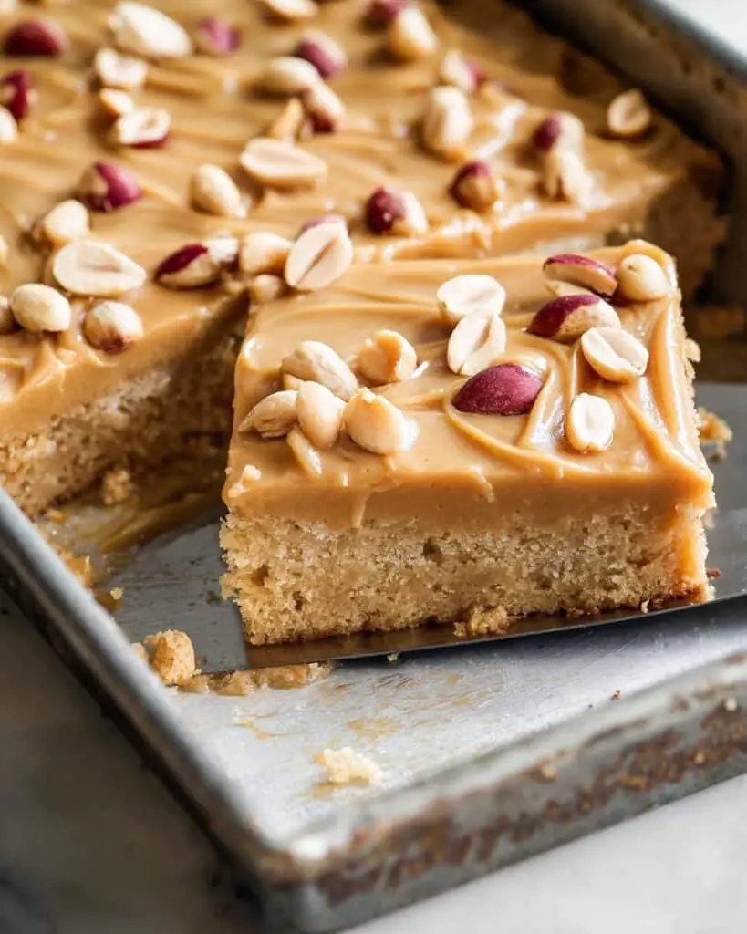 Peanut Butter Cake with Creamy Peanut Butter Frosting and Roasted Peanuts Recipe