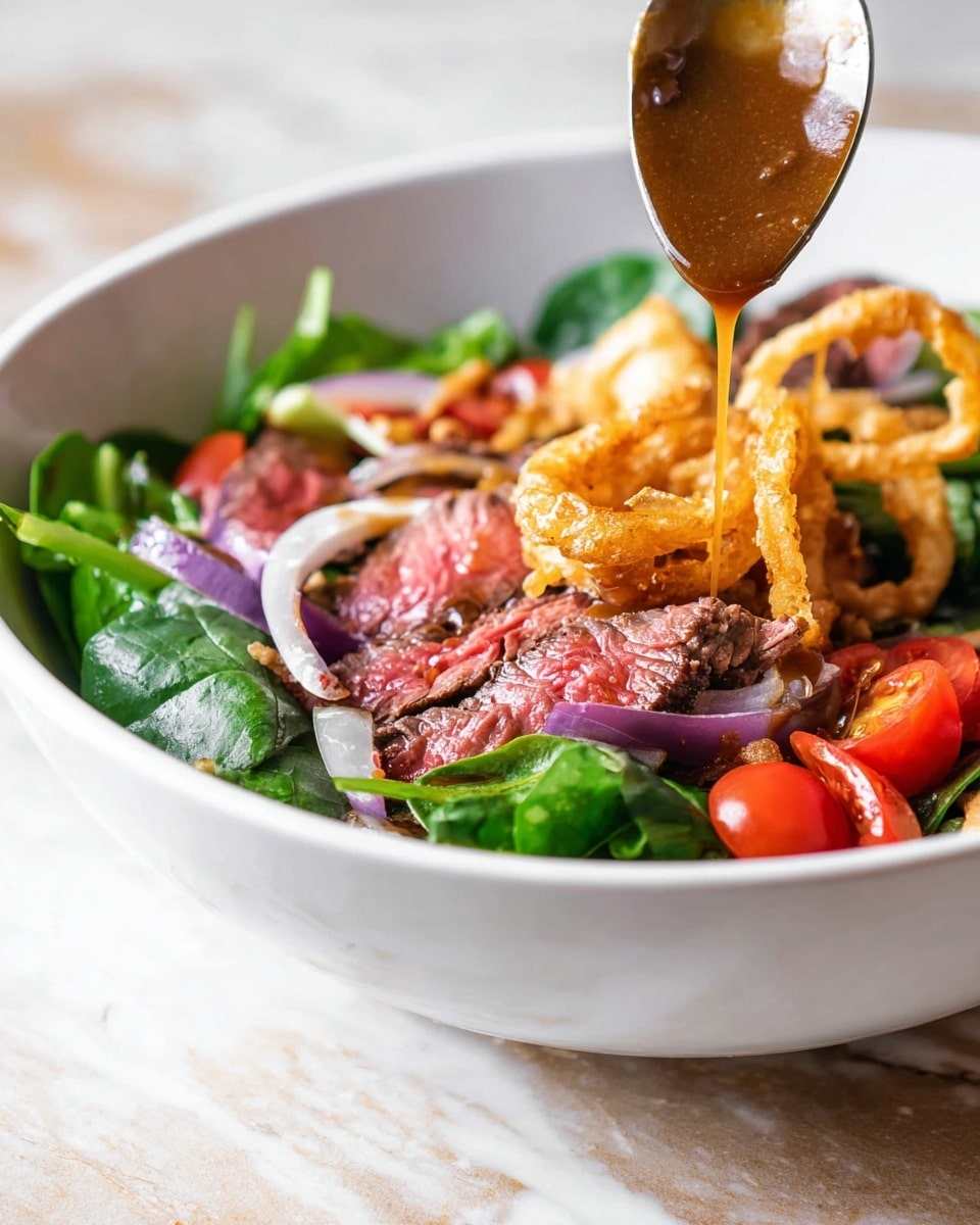 The image shows a fresh salad in a white bowl on a white marbled surface, with layers starting from a base of dark green spinach and mixed greens, topped with bright red cherry tomato halves, thin slices of purple onion, and golden, crispy fried onion rings. On top, there are medium-rare cooked beef slices with a pink center and a seared brown edge. A spoon is pouring a rich brown dressing over the beef, with a woman's hand holding the spoon just out of the frame. The colors are vibrant and the textures mix fresh veggies with tender meat and crunchy onions, creating a lively and appetizing look, photo taken with an iphone --ar 4:5 --v 7