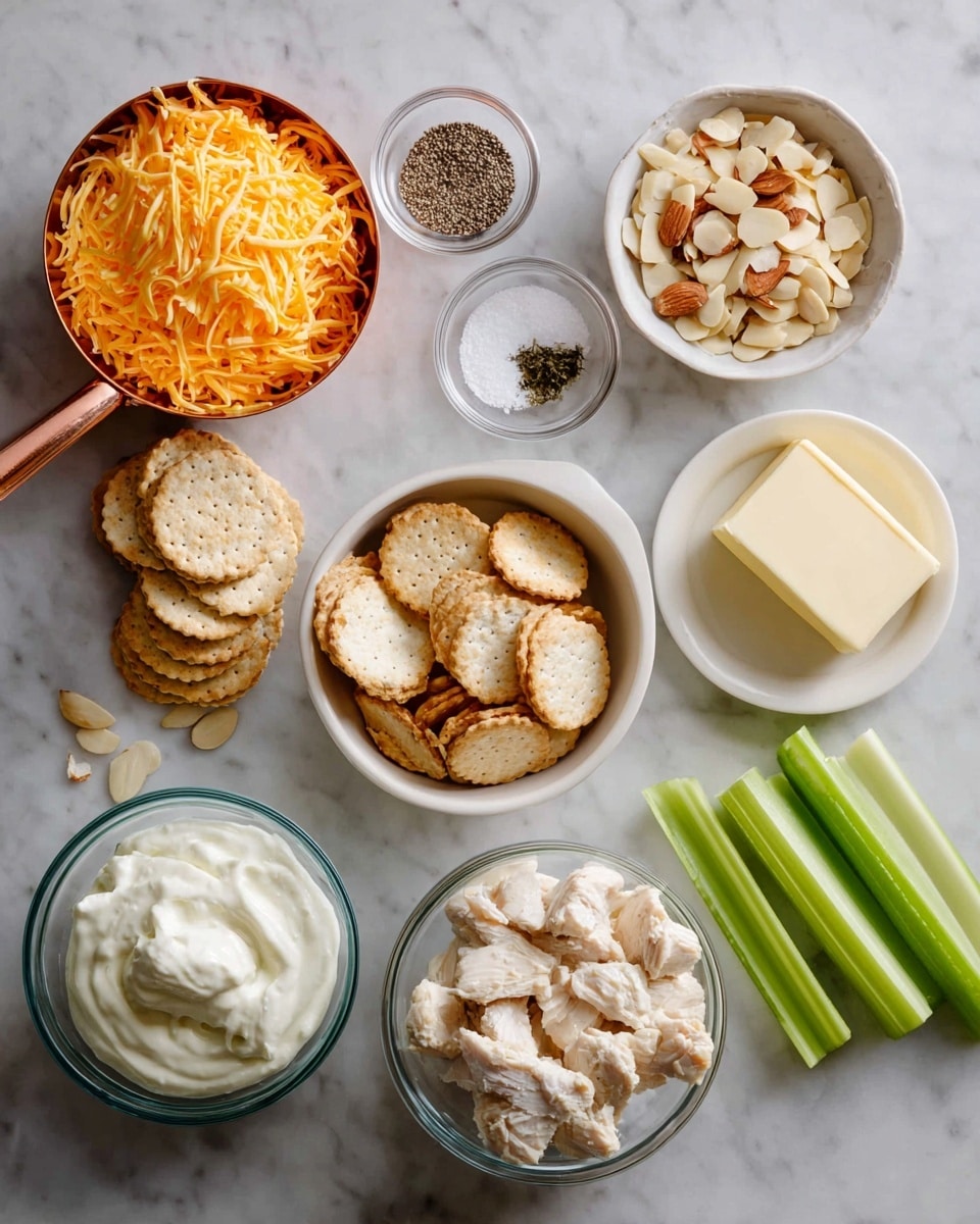 Several small white bowls and a measuring cup are arranged on a white marbled surface. A copper measuring cup on the top left holds orange shredded cheese. To its right is a small glass bowl with black pepper and another with salt. Below them, a white bowl contains round beige crackers, next to another white bowl filled with sliced almonds. To the right, a small white plate holds a stick of butter, and next to that are three green celery sticks. In the front, two glass bowls contain white creamy substances, and a large glass bowl on the right holds small, white pieces of cooked chicken. photo taken with an iphone --ar 4:5 --v 7