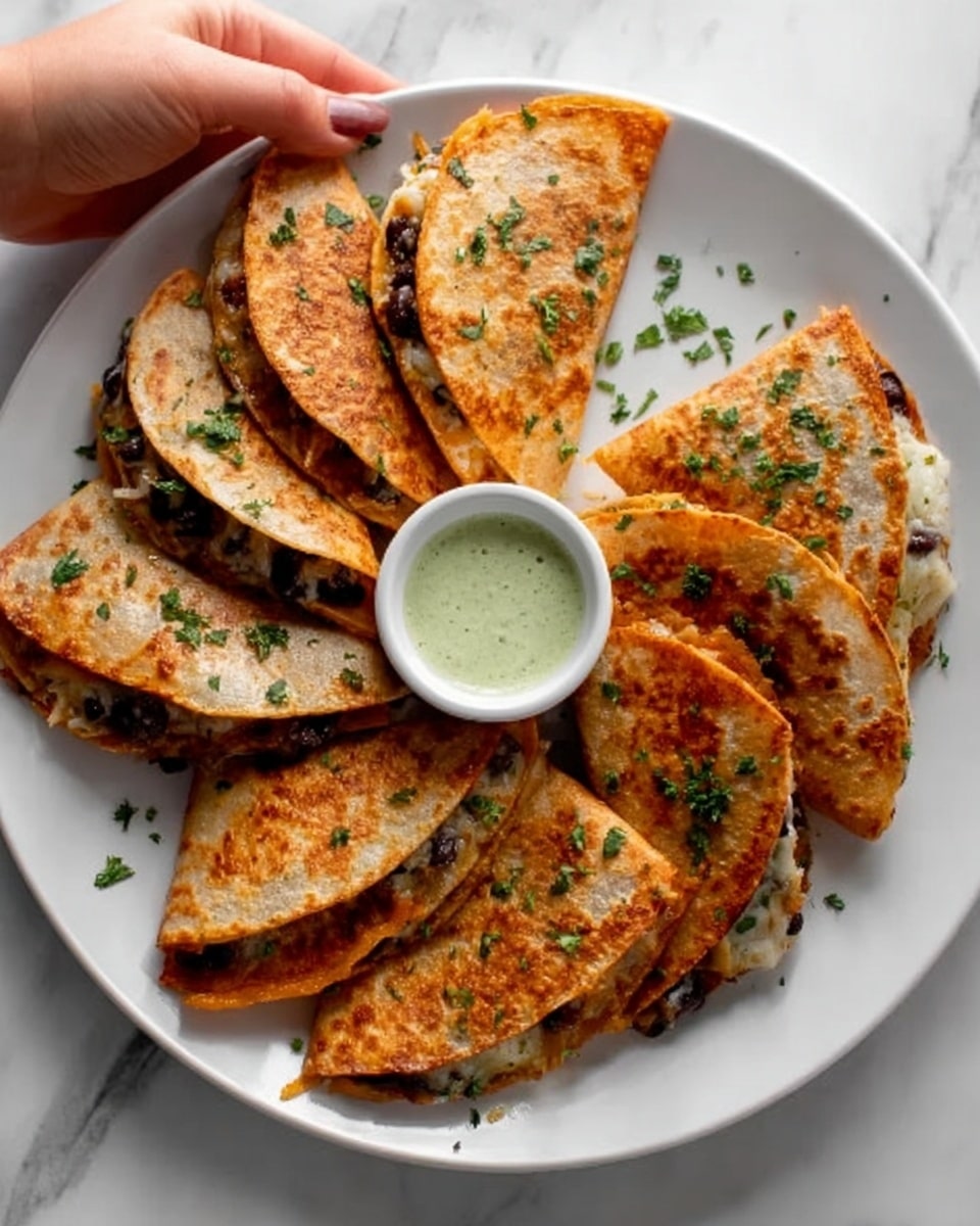A white plate holds seven folded, golden-brown tortillas arranged in a fan shape, each filled with a mix of black beans, yellow corn, and melted cheese visible along the edges. The tortillas have a slightly crispy texture with some darker spots and are sprinkled with small green herb pieces on top. Positioned near the top left of the plate is a small white bowl filled with a pale green creamy sauce. The plate sits on a white marbled surface with a white cloth featuring thin black stripes draped partially beneath it. photo taken with an iphone --ar 4:5 --v 7