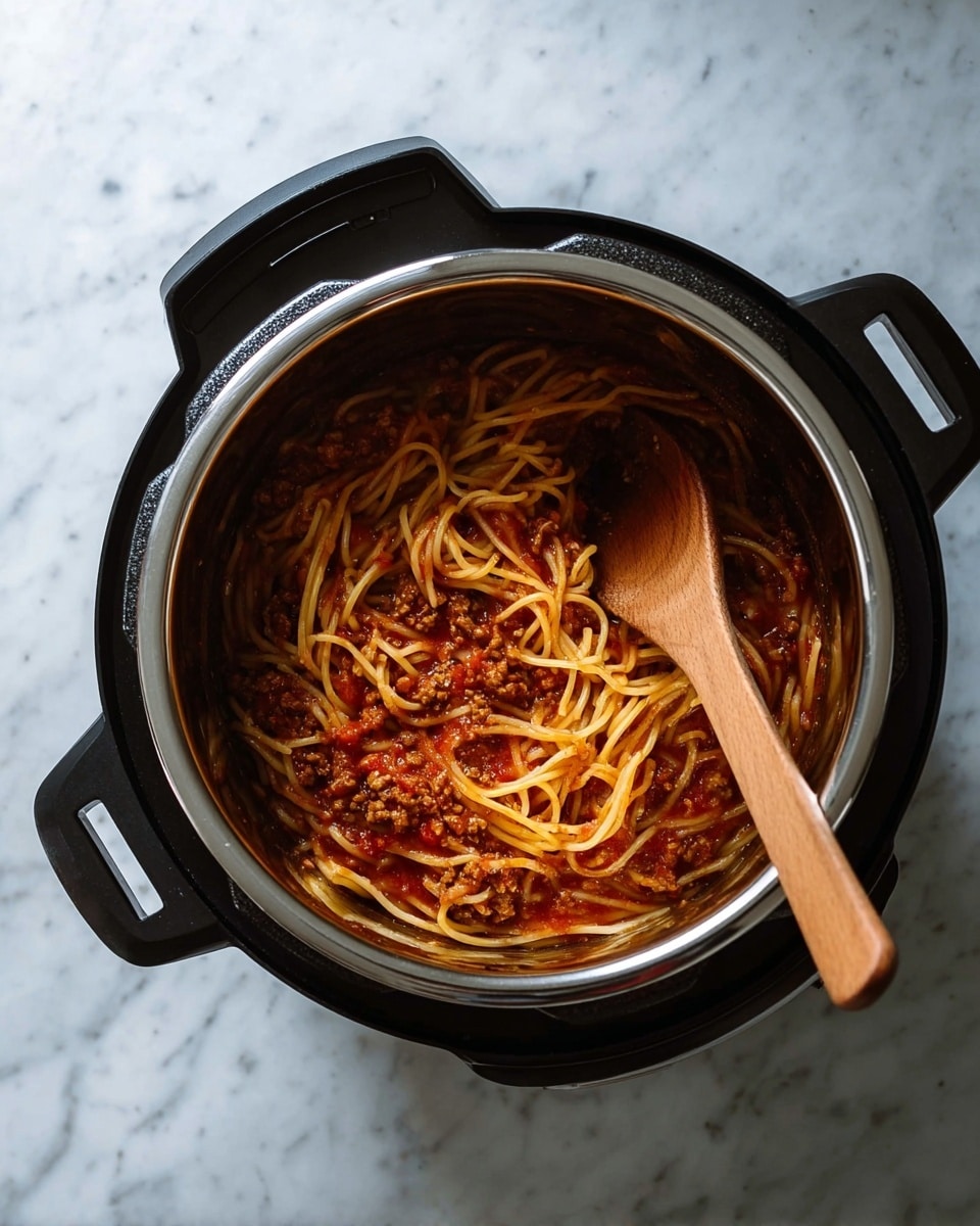 Two white bowls sit on a white marbled surface, each containing a serving of spaghetti mixed with a brown meat sauce, topped with a light sprinkle of grated cheese. Each bowl has two slices of white bread placed on the side, resting on the rim. A fork is placed inside each bowl, with their handles pointing outward. A soft beige cloth is partially visible near the bowls. The photo taken with an iphone --ar 4:5 --v 7