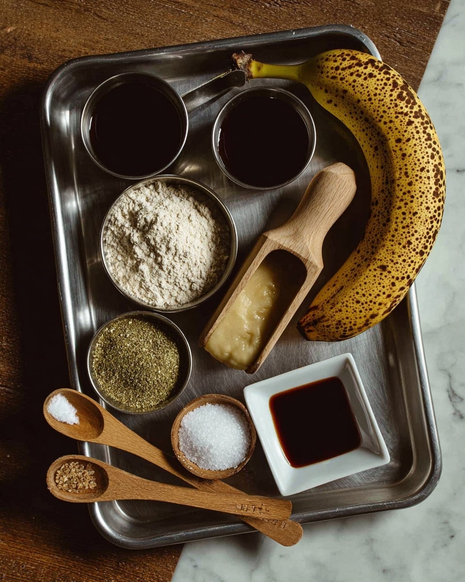 A flat, metal tray holds various ingredients arranged carefully on a wooden table. Near the top, a small round metal cup contains dark liquid, while another similar cup next to it holds a light, smooth puree. To the right, a ripe banana with dark brown spots curves along the tray’s edge. In the center, a wooden scoop is filled with pale beige flour. Below it, a small metal bowl has coarse green and brown powder. Nearby, two wooden measuring spoons lie on the tray; one is filled with white salt, and the other with white powder. At the bottom right, a small white square bowl holds a dark liquid. The tray and all items are set against a white marbled surface. Photo taken with an iphone --ar 4:5 --v 7