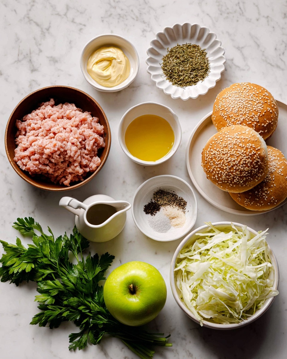 A close-up of two chicken sliders stacked with a golden-brown sesame seeded bun on top and bottom; the bottom layer is a thick, textured chicken patty with a light brown cooked exterior, topped with a creamy white coleslaw mixed with green herbs layered just beneath the top bun. The sliders sit on a white marble surface scattered with small bits of coleslaw and parsley. In the background, there are two clear glasses with slices of lemon inside, softly blurred. photo taken with an iphone --ar 4:5 --v 7