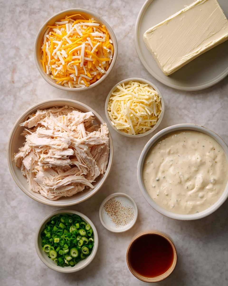 The image shows several white bowls and a white plate placed on a white marbled surface. At the top left is a bowl filled with yellow and white shredded cheese. To its right, a white plate holds a block of cream cheese with a smooth texture. Below this, a large white bowl contains shredded light pink cooked chicken. To the right of the chicken, there is a small white bowl with pale yellow shredded cheese. Lower in the image on the left side, a small white bowl is filled with chopped green onions. Next to it, a tiny white bowl contains a white powder, likely a seasoning. To the right, a white bowl holds a smooth, creamy white sauce speckled with seasoning. Finally, a large white cup of reddish-brown liquid sits near the bottom right corner. The layout is neat and organized. Photo taken with an iphone --ar 4:5 --v 7
