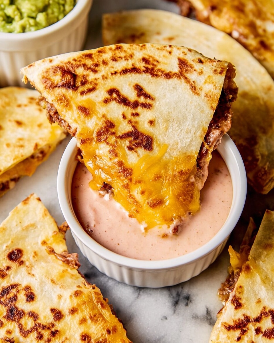 The image shows several folded tacos on a white marbled surface, each taco made from a golden-brown, soft tortilla folded in half. Inside the tacos are two visible layers: the first layer is a crumbly, cooked meat mixture with a rich brown color, and the second layer is melted cheddar cheese, bright yellow and oozing slightly out of the edges. The melted cheese also spreads onto the white marbled surface beneath the tacos. To the right, there is a small white bowl filled with smooth, light green guacamole. At the bottom left, a white bowl holds a pinkish sauce, and there is a wedge of fresh lime nearby. A metal spatula with a wooden handle is slid under one taco, lifting it slightly. The overall lighting highlights the warm colors and textures of the food. photo taken with an iphone --ar 4:5 --v 7